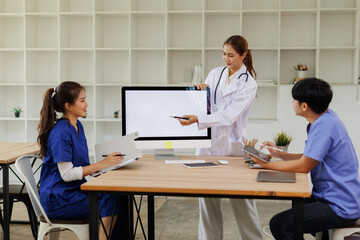 Fototapeta premium Doctors, nurse and women on desktop computer screen in meeting, collaboration for hospital planning, medical or life insurance. Talking, leadership and healthcare workers on paper in diversity researc