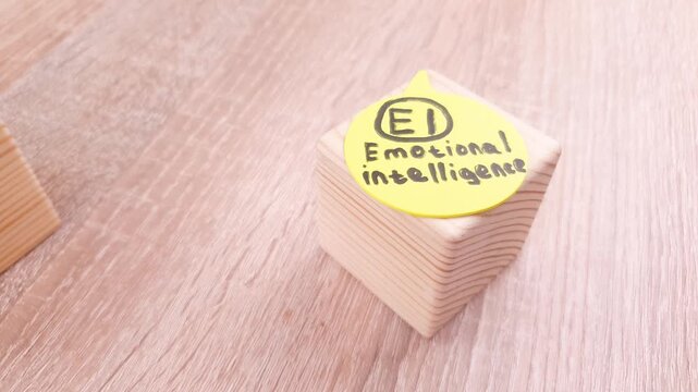 IQ EQ, emotional intelligence, emotional quotient on wooden cubes.