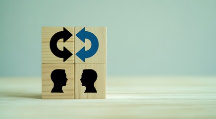 Conceptual image of knowledge sharing between two individuals using wooden blocks symbolizing exchanging ideas and information for mutual growth and understanding in business