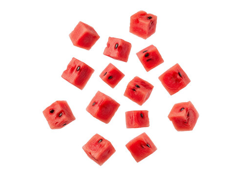 Vibrant Red Watermelon Cubes Scattering and Falling, Isolated on White Background