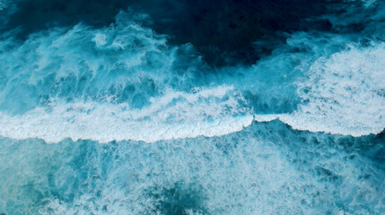 Turquoise ocean sea water white wave splashing deep blue sea. Bird eye view monster wave splash on rock. Tropical sea beach in summer seaside outdoor. Ocean island beautiful dramatic landscape.