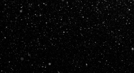 Obraz premium Atmospheric snowfall effect on a stark black background, showcasing winter textures and weather