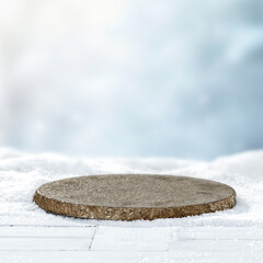 Winter landscape with fresh white snow and copy space for product placement or text. Blurred  snow-covered trees and cloudy winter sky background.