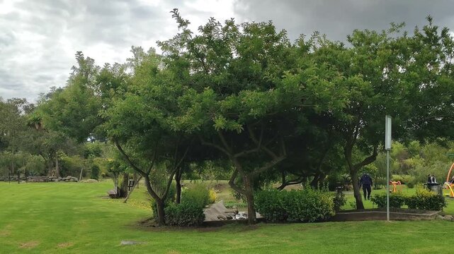 Panoramic motion video at el paraiso park, a largest riverside park with vast green areas located in Cuenca city, Ecuador
