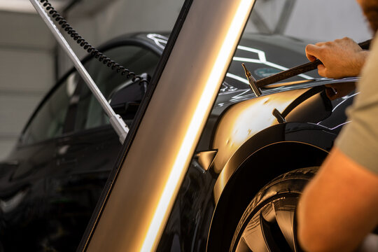 Car Dent Removal Specialist at Work