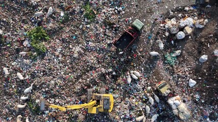 Landfill Aerial View Featuring Heavy Equipment and Scavenging Birds - Powered by Adobe