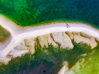 Aerial top view of sandbar with sea surface summer background and summer holiday concept
