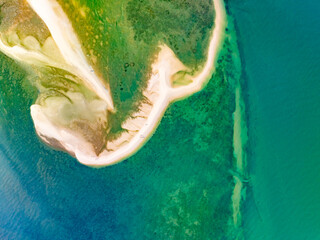 Aerial top view of sandbar with sea surface summer background and summer holiday concept
