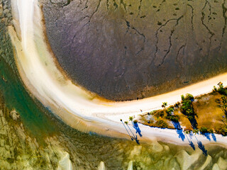 Aerial top view of sandbar with sea surface summer background and summer holiday concept