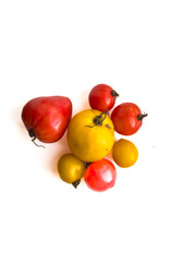 Variety of ripe yellow and red tomatoes