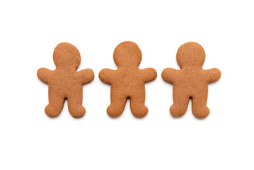 Three gingerbread cookies in shape of men isolated on white background