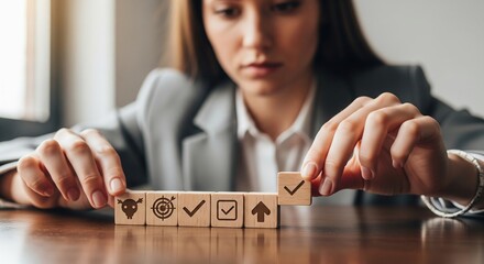 Hyperrealistic close-up of a woman's hand organizing wooden blocks symbolizing business strategy, targets, and progress on a desk, with soft natural light emphasizing determination and planning