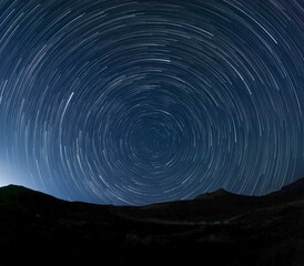 Time-lapse of stars rotating around the southern sky in the Milky Way over Karoo National Park, Beaufort West, Western Cape, South Africa. Stunning astrophotography and night sky landscape.