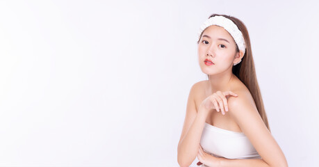 Beautiful asian woman touching fresh skin after cleansing on white background Glamour teenager...