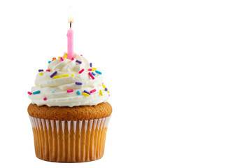 A cupcake, pink/white liner, white vanilla buttercream, colorful sprinkles, lit pink candle on bright white background, copy space, shallow DOF, Birthday celebration atmosphere