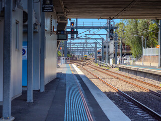 22 September 2025 Commuter Train fast moving through a Ashfield train Station in Sydney NSW Australia locomotive electric light rail