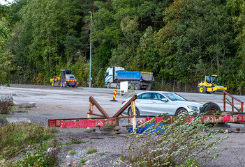 Yacht mooring site repair, work equipment and bulldozer, asphalt paving.