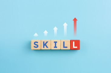 Arrows pointing up with SKILL words on wooden cubes
