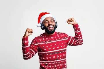 Joyful man sweater headphones christmas.