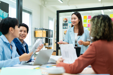 Group of young asian creative business brain storm meeting presentation,discussing roadmap to product launch, planning,strategy,new business development,working with new startup project in office.