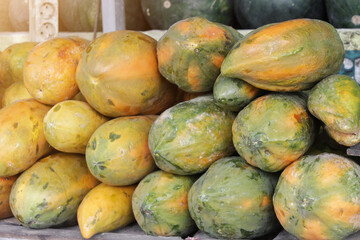 Fresh Papayas Piled High at Market Stand