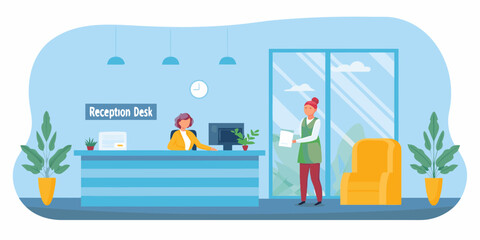 Modern office reception area with two women at the reception desk and a waiting chair