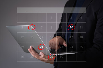 Businessman using laptop with transparent calendar overlay and highlighted dates. Ideal for scheduling, appointment reminders, project deadlines, task planning, and time management concepts.