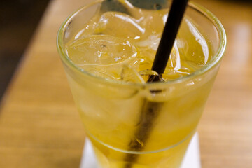 Close-up of the ice green tea. A glass of cold tea. Food and beverage concept. Cold drink. Drink background. 