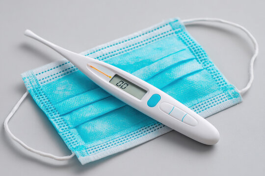 Thermometer on surgical mask for health safety