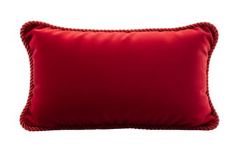 Luxurious red velvet decorative pillow with a cord trim, presented against a pure black background.