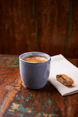 Cup of coffee on rustic wooden background. Soft focus. Copy space	