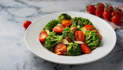 fresh broccoli salad with cherry tomatoes and almonds served in a white dish on a marble surface