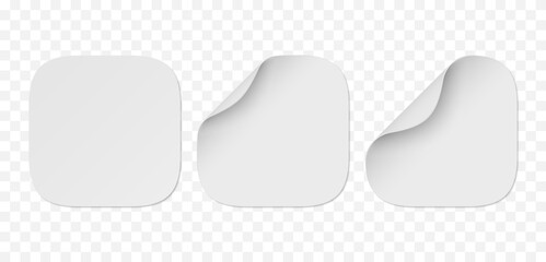 Vector set of white paper squircle stickers isolated on transparent background. Realistic square stickers curved with white corner and soft shadows.