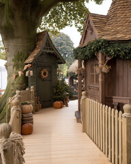 Charming Rustic Pathway Leading to Quaint Wooden Village Cottages