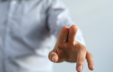 Naklejka premium Close-up of a hand reaching towards the viewer, symbolizing connection, choice, and interaction.