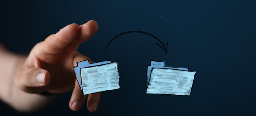 Abstract image of hand interacting with digital folders, symbolizing data transfer, workflow, and...