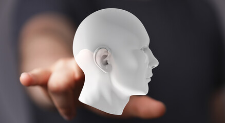 Stock photo of a hand presenting a 3D model of a human head, symbolizing AI, technology, and the future.