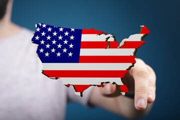 Hand interacts with a digital US map designed with the American flag. Ideal for concepts of freedom, nation, and technology.