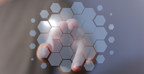 Abstract image of a finger interacting with a futuristic hexagon interface.  Perfect for tech,...