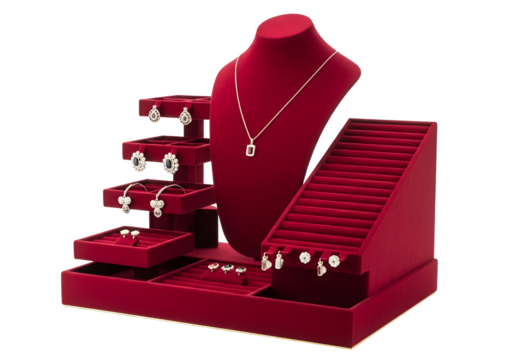 A red velvet jewelry display case with multiple tiers and compartments showcases a variety of exquisite pieces.