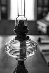  kerosene lamp against window in room