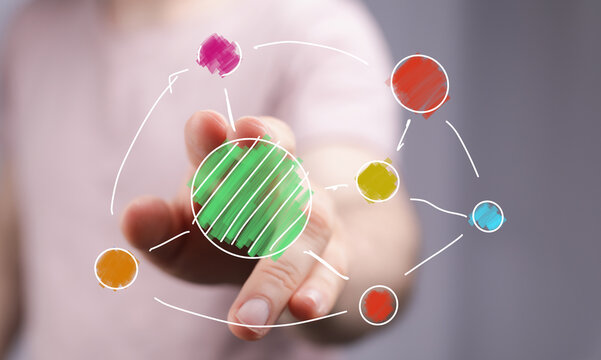 Abstract image of a hand interacting with a colorful network diagram, symbolizing connection, innovation, and growth.