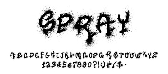 A set of letters, numbers, and symbols is spray-painted in a rough style, showcasing a vibrant urban art form with fuzzy edges and splattered details.