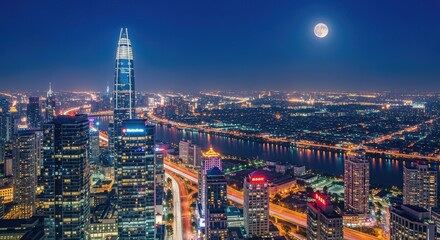Obraz premium Night view of Ho Chi Minh City with the Bitexco Financial Tower illuminated.