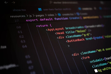 Close-up ofcode using JSX syntax in a component return block, showing structured UI layout, class names, and frontend elements used in modern web application development with TypeScript.