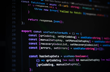 Close-up of computer screen displaying JavaScript code with syntax highlighting, representing software development, programming, two-factor authentication, and web application security.