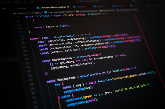 Close-up of JavaScript programming interface on a dark screen, illustrating two-factor authentication system logic, secure web development, and modern software engineering practices. - Powered by Adobe