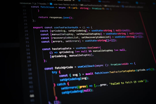 Close-up of colorful JavaScript code on dark screen showing two-factor authentication logic, used in web development, programming, secure login systems, and modern cybersecurity practices.