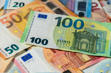 Euro Banknotes Scattered on Table