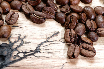 Coffee beans on the dark wooden background